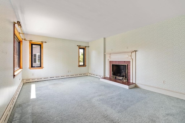 unfurnished living room featuring carpet flooring, a baseboard heating unit, and a brick fireplace
