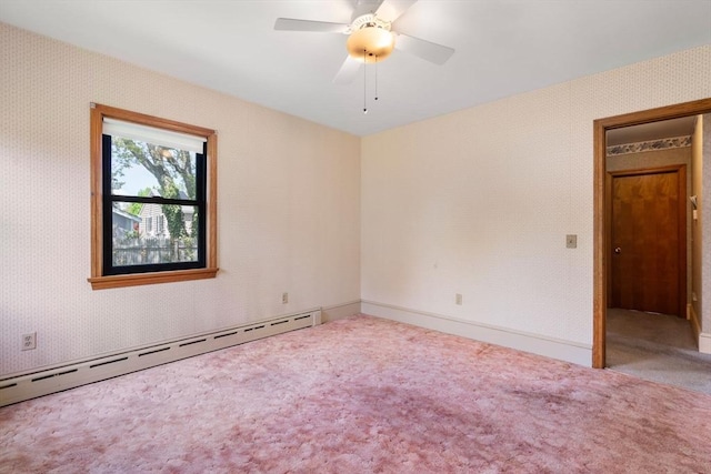 empty room with baseboard heating, carpet floors, and ceiling fan