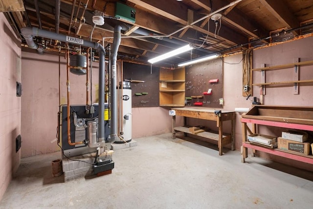 unfinished basement featuring a workshop area and water heater