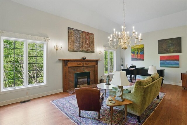 12 Vose Hill Rd, Westford, MA 01886 - living area featuring a fireplace, wood finished floors, and baseboards