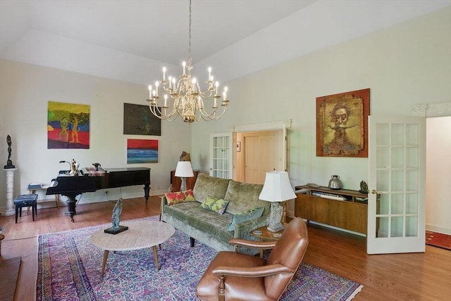 12 Vose Hill Rd, Westford, MA 01886 - living area featuring wood finished floors, french doors, a chandelier, baseboards, and lofted ceiling