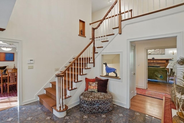 12 Vose Hill Rd, Westford, MA 01886 - staircase with a towering ceiling and baseboards
