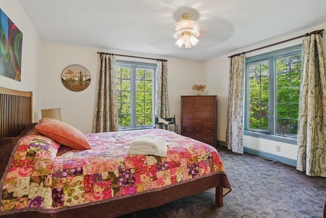 12 Vose Hill Rd, Westford, MA 01886 - carpeted bedroom with multiple windows, baseboards, and ceiling fan