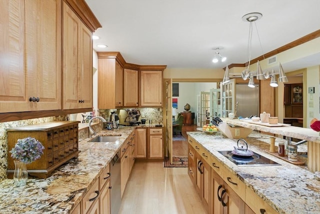 12 Vose Hill Rd, Westford, MA 01886 - kitchen featuring a sink, light wood-style flooring, stainless steel appliances, light stone countertops, and backsplash