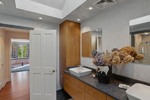 12 Vose Hill Rd, Westford, MA 01886 - full bathroom with double vanity, wood finished floors, and a shower with shower door
