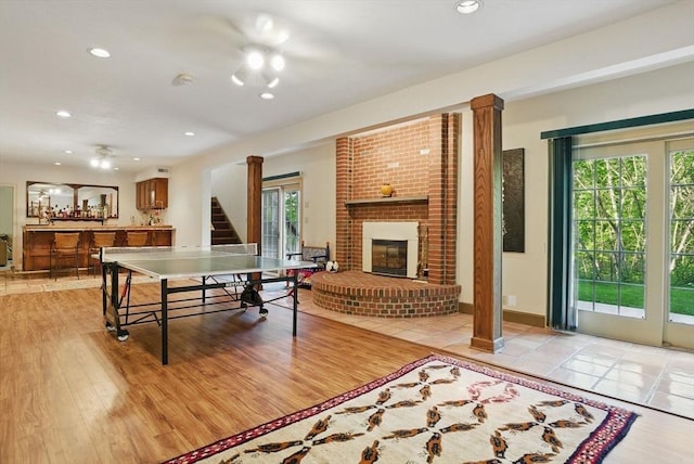 12 Vose Hill Rd, Westford, MA 01886 - playroom featuring light wood-style floors, a fireplace, and recessed lighting