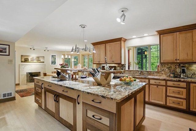 12 Vose Hill Rd, Westford, MA 01886 - kitchen with a sink, light wood-style floors, healthy amount of natural light, and recessed lighting