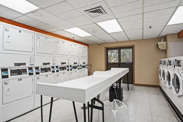 133 Commander Shea Blvd Unit 713, Quincy, MA 02171 - shared laundry room featuring stacked washer / dryer, baseboards, and washing machine and dryer