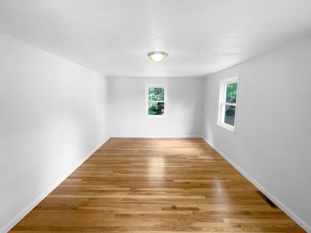 unfurnished room featuring light wood-type flooring