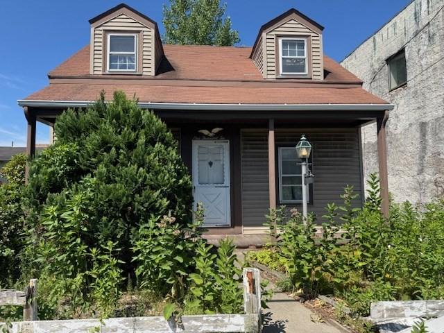 1002 Charles St, North Providence, RI 02904 - view of front of house featuring covered porch