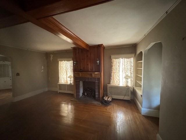 1002 Charles St, North Providence, RI 02904 - unfurnished living room with arched walkways, a fireplace, ornamental molding, and beamed ceiling