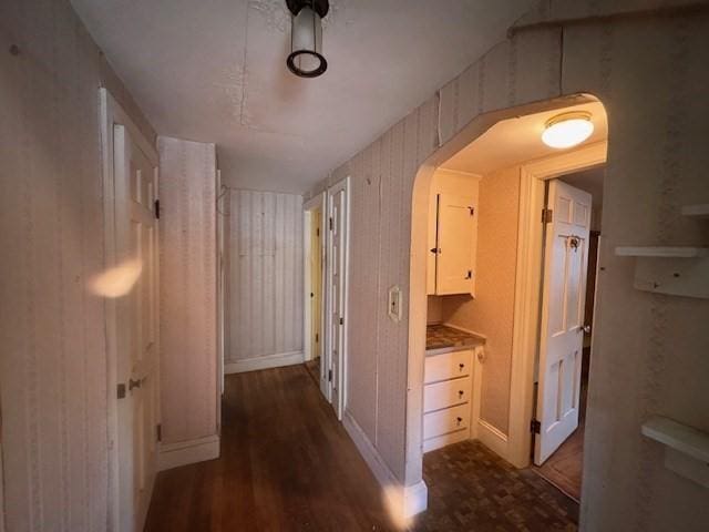 1002 Charles St, North Providence, RI 02904 - hall featuring dark wood-style floors and arched walkways