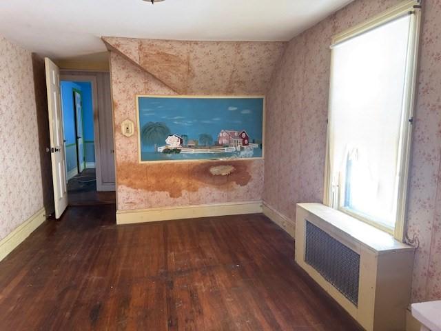 1002 Charles St, North Providence, RI 02904 - unfurnished living room featuring hardwood / wood-style floors and wallpapered walls