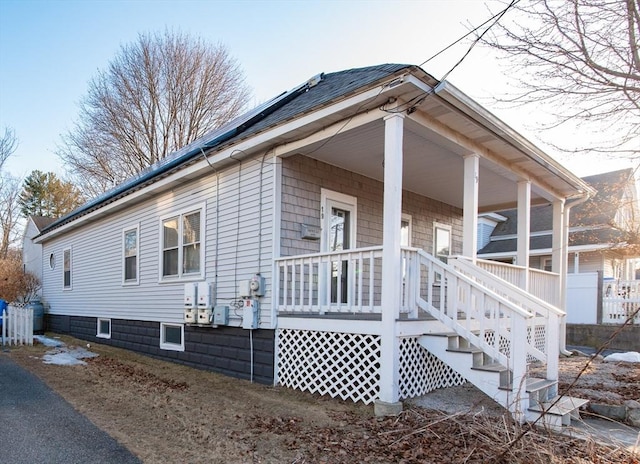 view of property exterior with covered porch