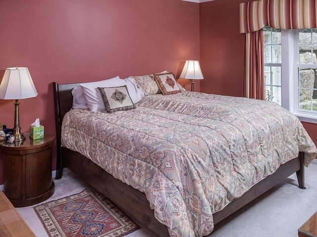 carpeted bedroom with multiple windows
