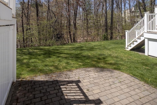 view of yard with stairs and a patio area