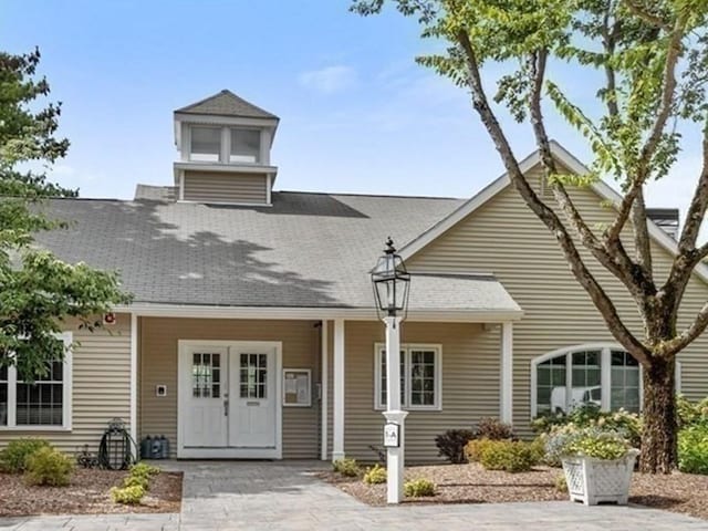 view of front of house featuring a shingled roof