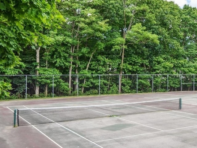 view of sport court featuring fence and community basketball court