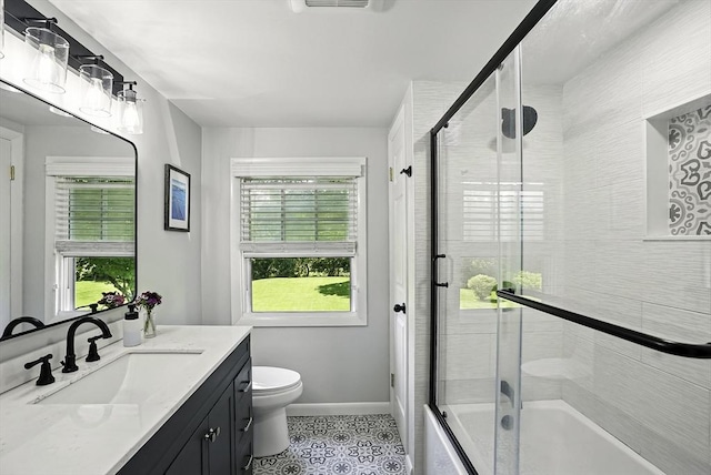 1112 Highland St, Holliston, MA 01746 - bathroom featuring plenty of natural light, vanity, toilet, and tile patterned floors