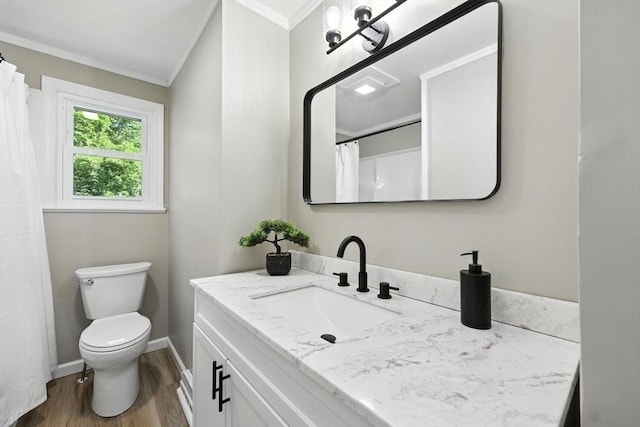 908 Tinkham Rd, Wilbraham, MA 01095 - full bath with ornamental molding, vanity, and wood finished floors