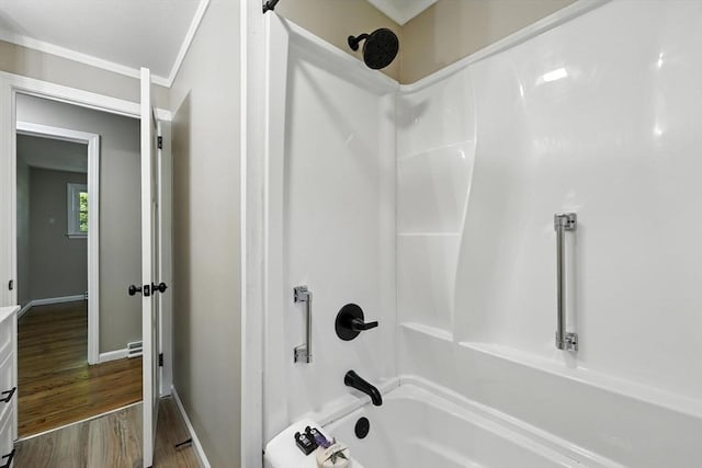 908 Tinkham Rd, Wilbraham, MA 01095 - full bathroom with bathing tub / shower combination, wood finished floors, and ornamental molding