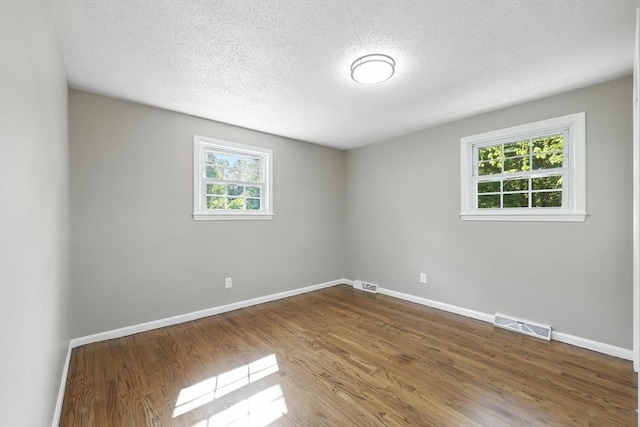 908 Tinkham Rd, Wilbraham, MA 01095 - unfurnished room with wood finished floors and a textured ceiling