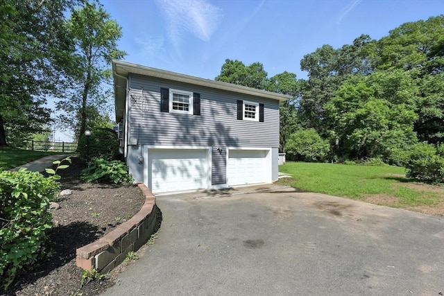 908 Tinkham Rd, Wilbraham, MA 01095 - view of property exterior with asphalt driveway and a garage
