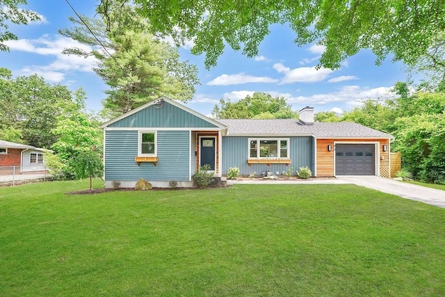 93 Pittroff Ave, South Hadley, MA 01075 - view of front of home with driveway, an attached garage, and a chimney