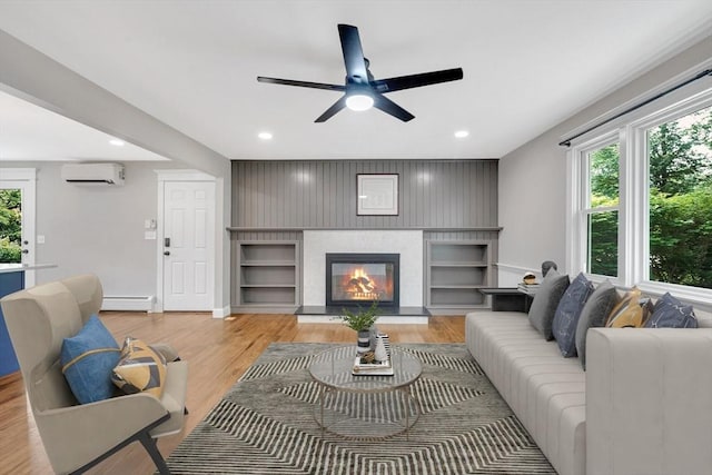 93 Pittroff Ave, South Hadley, MA 01075 - living room featuring baseboard heating, plenty of natural light, ceiling fan, a glass covered fireplace, and recessed lighting