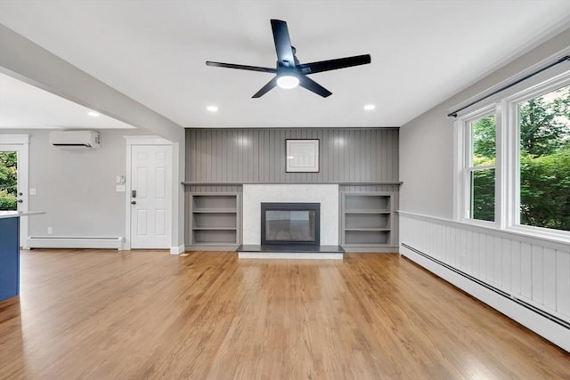 93 Pittroff Ave, South Hadley, MA 01075 - unfurnished living room with a baseboard heating unit, plenty of natural light, a wall unit AC, and recessed lighting