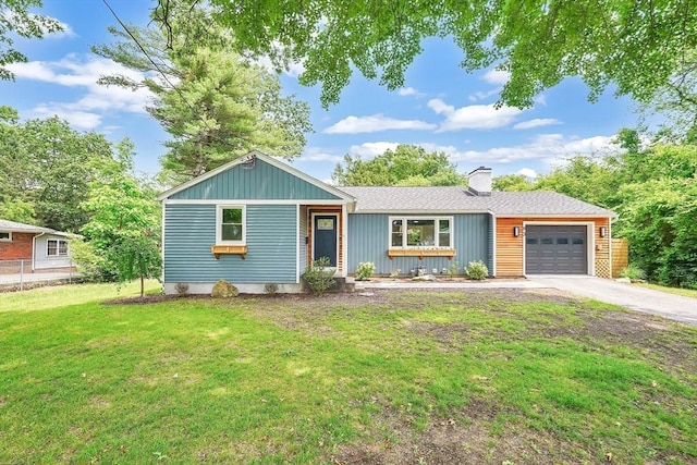 93 Pittroff Ave, South Hadley, MA 01075 - view of front of house featuring a garage, concrete driveway, and a chimney