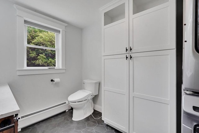 93 Pittroff Ave, South Hadley, MA 01075 - bathroom with baseboard heating, vanity, and tile patterned flooring