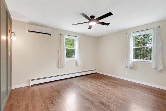 93 Pittroff Ave, South Hadley, MA 01075 - empty room featuring baseboard heating, a wall mounted air conditioner, wood finished floors, and ceiling fan