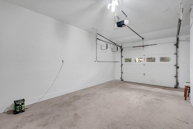 93 Pittroff Ave, South Hadley, MA 01075 - garage with a garage door opener and baseboards
