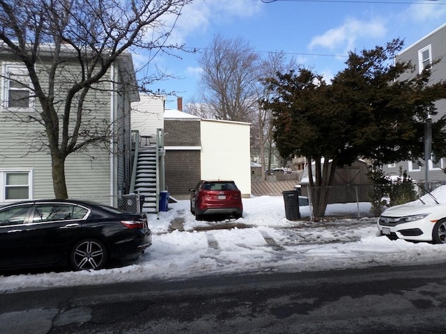 57 Bloomingdale St, Chelsea, MA 02150 - exterior space featuring stairway and fence