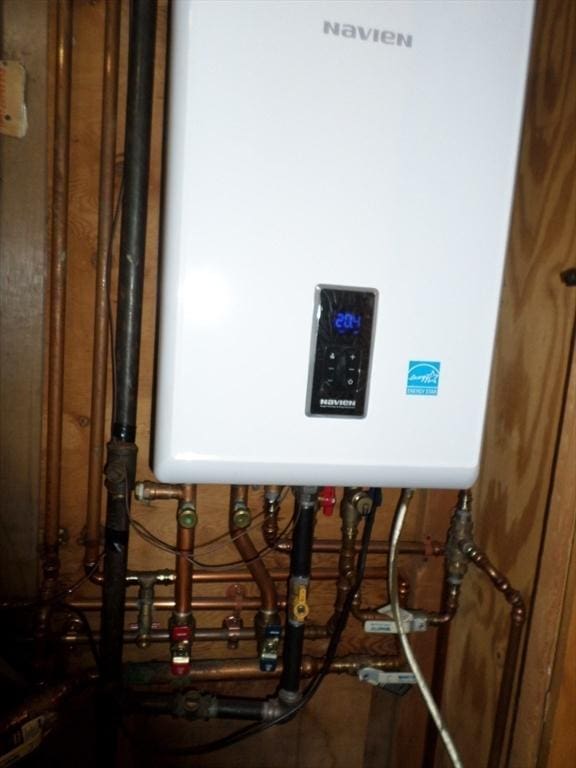 57 Bloomingdale St, Chelsea, MA 02150 - utility room featuring tankless water heater