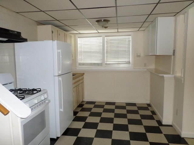 57 Bloomingdale St, Chelsea, MA 02150 - kitchen with light countertops, dark floors, white gas range oven, and under cabinet range hood