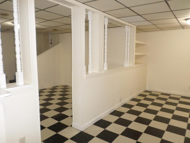57 Bloomingdale St, Chelsea, MA 02150 - finished basement featuring tile patterned floors, baseboards, and a paneled ceiling