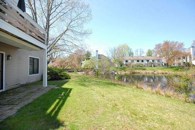 view of yard with a water view