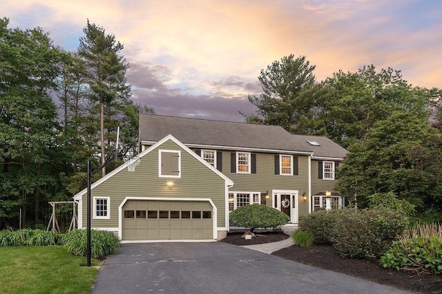 10 Reinsway Cir, Westford, MA 01886 - colonial inspired home featuring asphalt driveway and a garage
