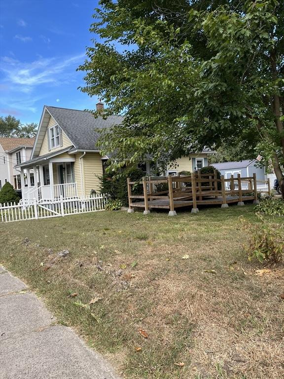 exterior space with a front lawn