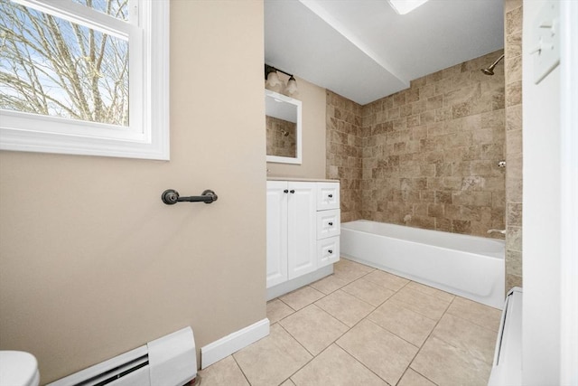 bathroom featuring a healthy amount of sunlight, a baseboard radiator, and tile patterned flooring