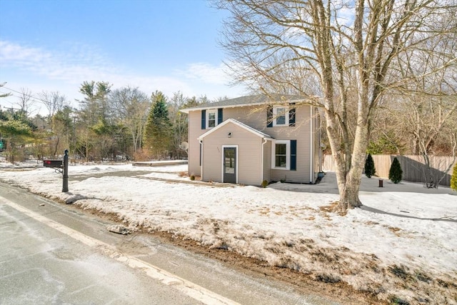 view of front of house featuring fence