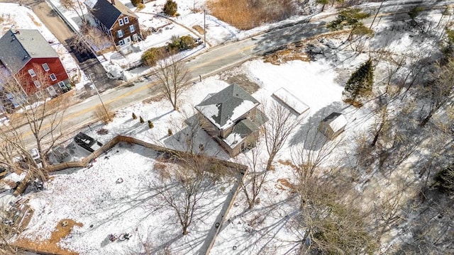 snowy aerial view with a residential view