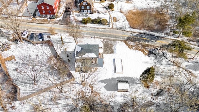snowy aerial view featuring a residential view