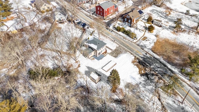 snowy aerial view featuring a residential view