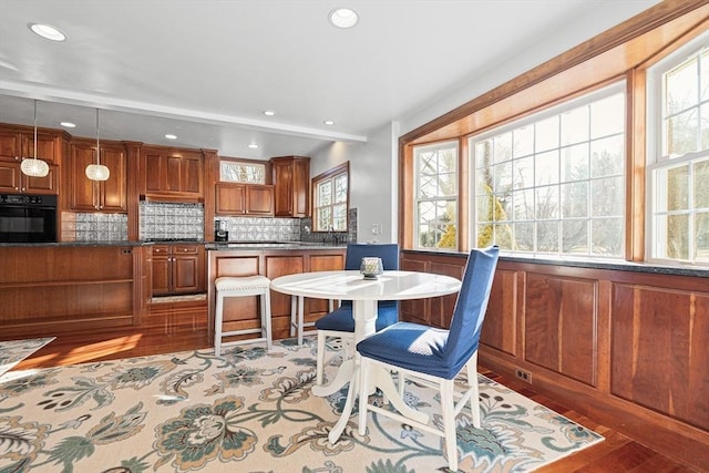 dining room with recessed lighting and light wood-style flooring