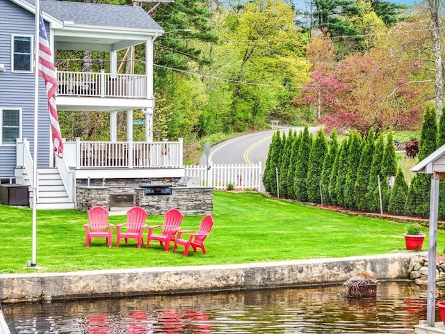 2 Coles Grove Rd, Derry, NH 03038 - view of yard with a balcony, a water view, an outdoor fire pit, and cooling unit