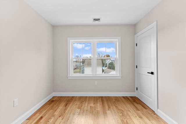 unfurnished room with light hardwood / wood-style flooring