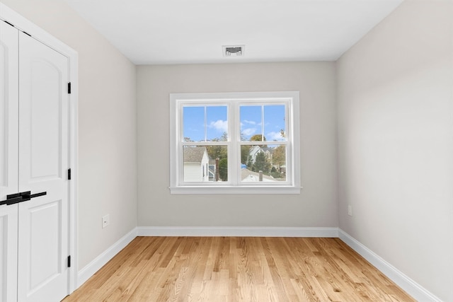 spare room featuring light wood-type flooring